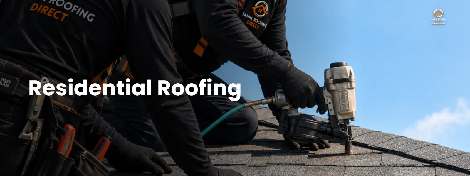 Roofing crew installing a residential shingle roof